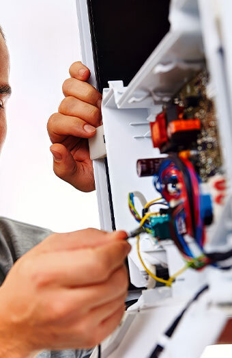 Electrician Connecting Switchboard Power